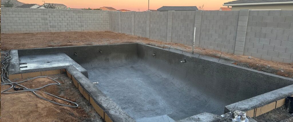 Arizona pool shotcrete shell freshly sprayed at sunset